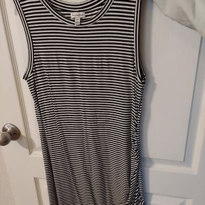 Fitted sleeveless, striped summer dress. Mid-thigh length.